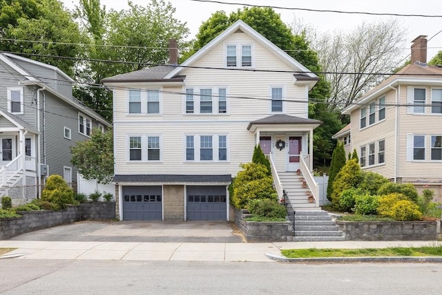 72 Edgecliff Rd Unit 72, Watertown, MA 02472 - view of front facade featuring an attached garage, concrete driveway, and stairs