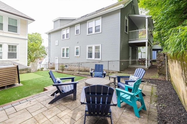 72 Edgecliff Rd Unit 72, Watertown, MA 02472 - view of patio / terrace featuring an outdoor fire pit and a balcony