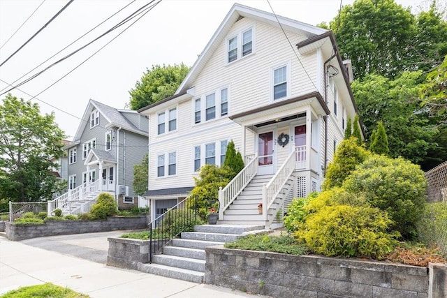 72 Edgecliff Rd Unit 72, Watertown, MA 02472 - view of front facade with stairway, a garage, concrete driveway, and a porch