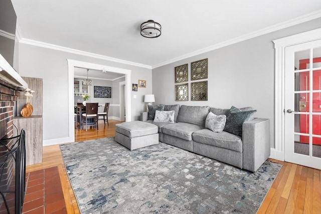 72 Edgecliff Rd Unit 72, Watertown, MA 02472 - living area featuring ornamental molding, hardwood / wood-style flooring, a chandelier, a fireplace, and baseboards