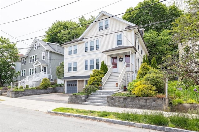 72 Edgecliff Rd Unit 72, Watertown, MA 02472 - view of front facade with stairs, concrete driveway, and an attached garage