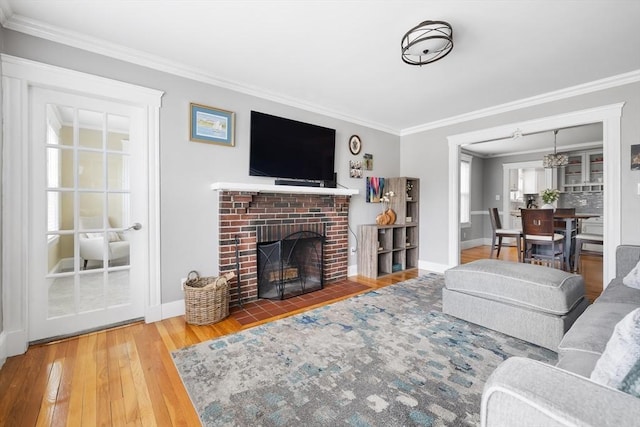 72 Edgecliff Rd Unit 72, Watertown, MA 02472 - living area with ornamental molding, hardwood / wood-style flooring, a fireplace, and baseboards