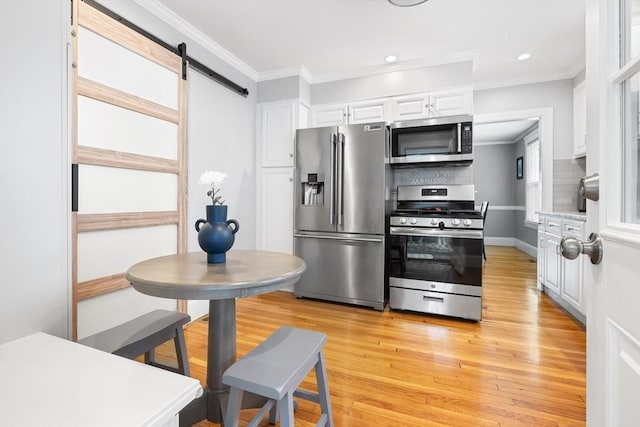 72 Edgecliff Rd Unit 72, Watertown, MA 02472 - kitchen featuring stainless steel appliances, crown molding, white cabinetry, light wood-type flooring, and recessed lighting