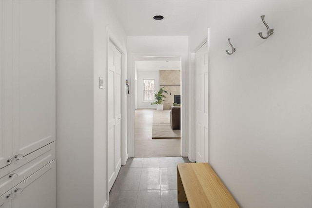 corridor with light tile patterned floors