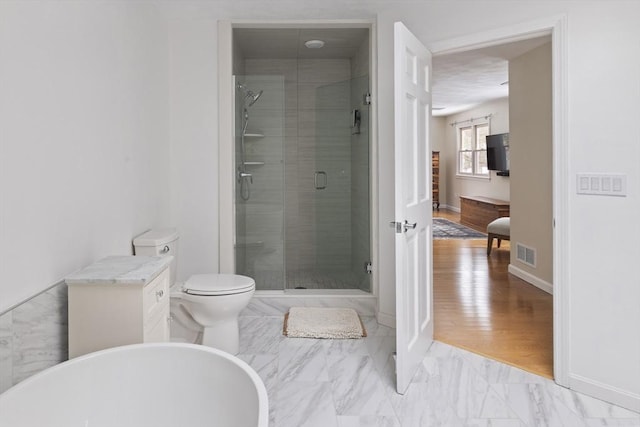 full bath featuring a stall shower, baseboards, visible vents, toilet, and marble finish floor