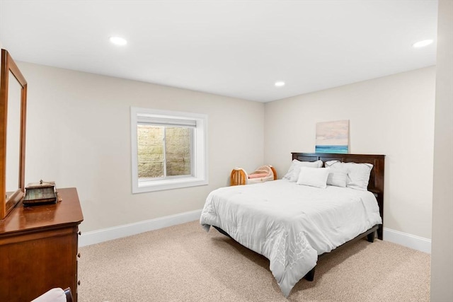 carpeted bedroom featuring recessed lighting and baseboards