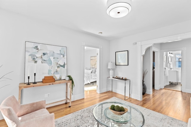 living area with hardwood / wood-style flooring