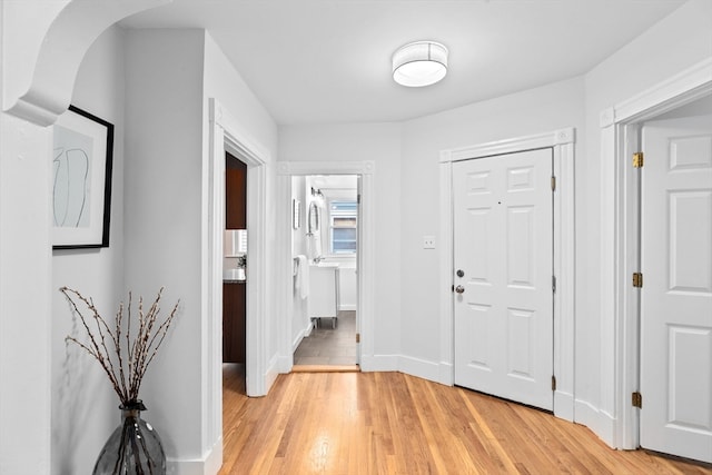 hall with light hardwood / wood-style floors