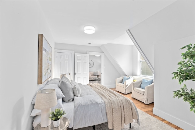 bedroom with hardwood / wood-style floors