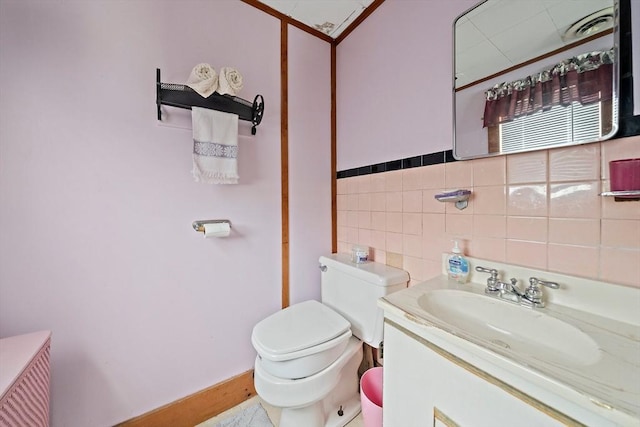 14 Mcarthur Ln, Marshfield, MA 02050 - bathroom featuring toilet, vanity, and tile walls