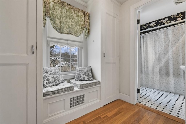 bathroom with wood-type flooring