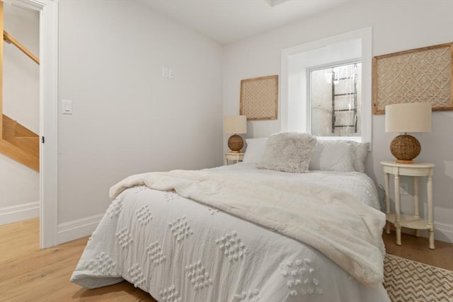 bedroom with light hardwood / wood-style flooring