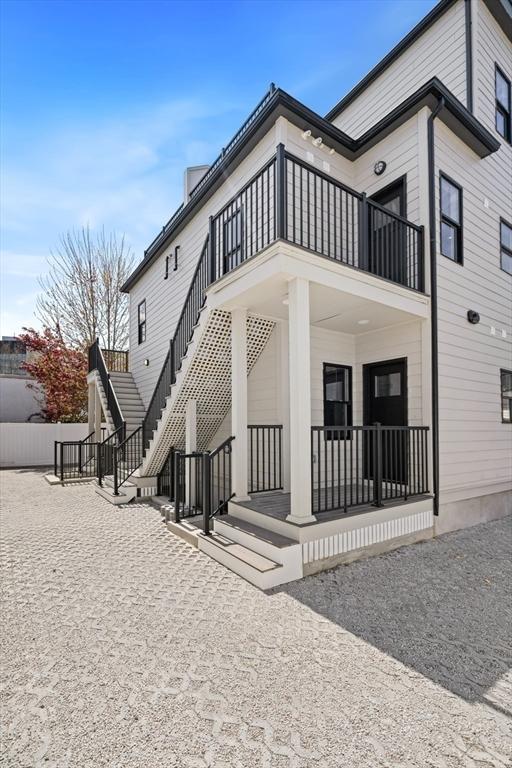 rear view of house with a balcony