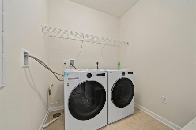 clothes washing area with independent washer and dryer