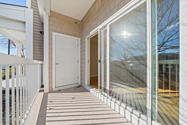 entrance to property featuring a balcony