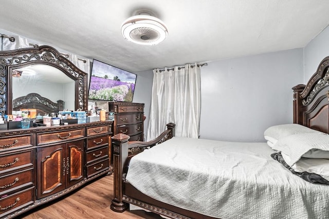 bedroom with light wood finished floors