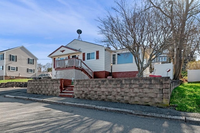 view of front of home featuring stairs
