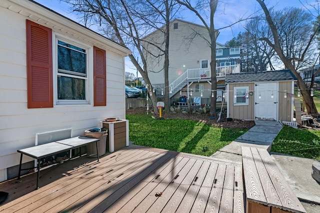 deck featuring a storage shed, a yard, and an outdoor structure