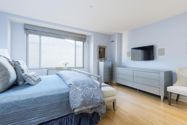 bedroom featuring light hardwood / wood-style floors