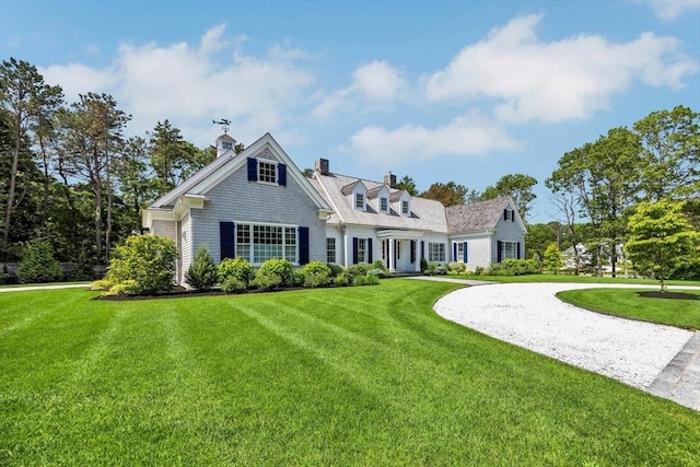 10 Herring Gull Rd, Mashpee, MA 02649 - view of front of property with a front lawn, a chimney, and curved driveway