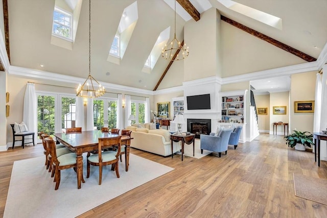 10 Herring Gull Rd, Mashpee, MA 02649 - dining area with a skylight, high vaulted ceiling, a chandelier, healthy amount of natural light, and beamed ceiling