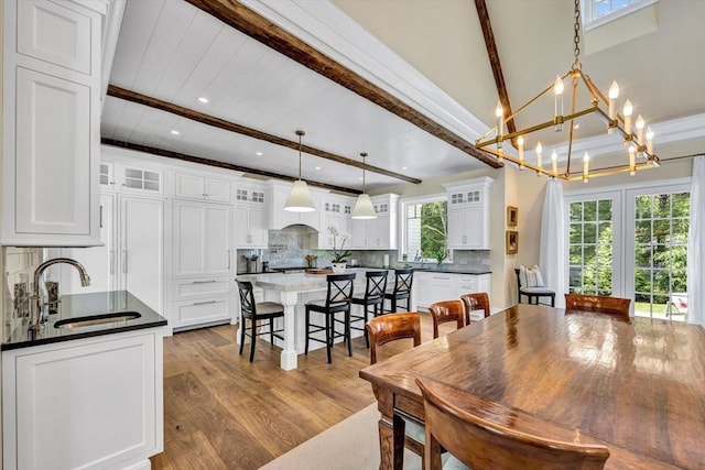 10 Herring Gull Rd, Mashpee, MA 02649 - dining area featuring beamed ceiling, wood finished floors, a chandelier, and recessed lighting