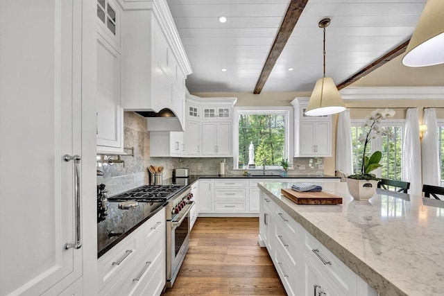 10 Herring Gull Rd, Mashpee, MA 02649 - kitchen featuring stainless steel range, white cabinets, beamed ceiling, hanging light fixtures, and glass insert cabinets