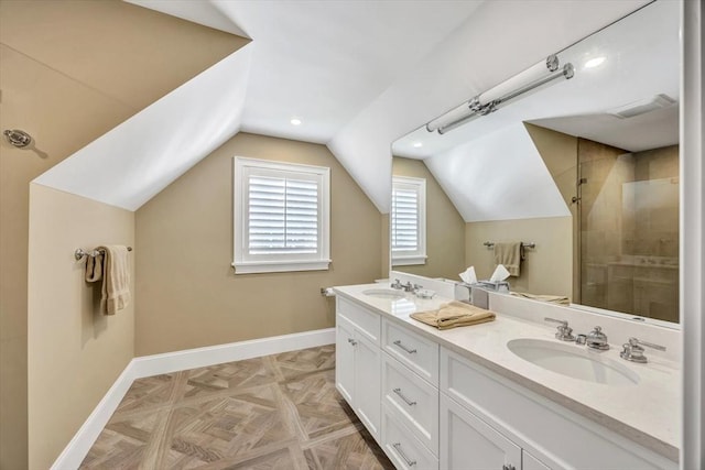 10 Herring Gull Rd, Mashpee, MA 02649 - full bathroom with double vanity, lofted ceiling, and tiled shower