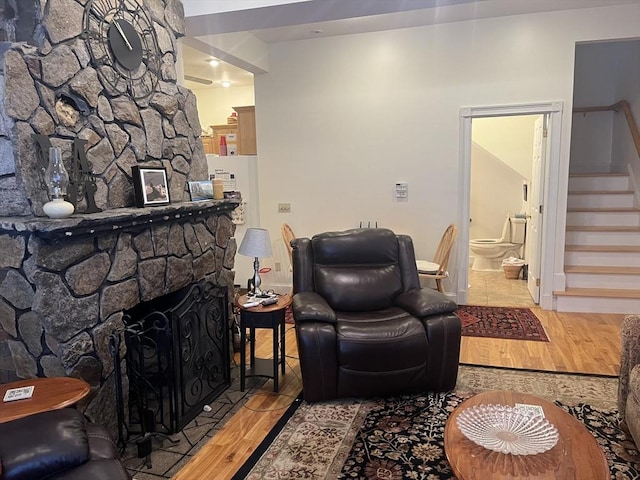 living room with a fireplace and light hardwood / wood-style floors