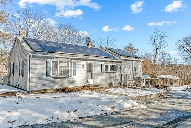 view of front of house with solar panels