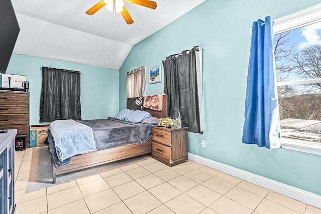 tiled bedroom featuring ceiling fan and vaulted ceiling