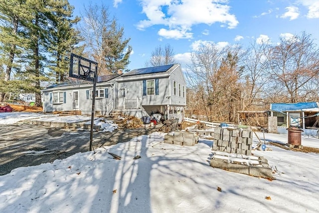 view of front of home featuring solar panels