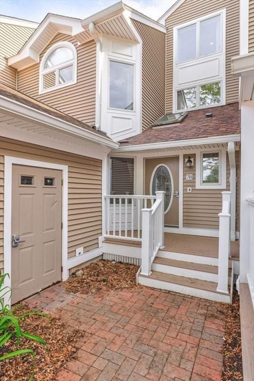 78 Pointe Rok Dr Unit 78, Worcester, MA 01604 - doorway to property featuring roof with shingles