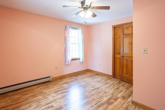 18 Oakwind Holw, Leominster, MA 01453 - empty room with baseboard heating, light wood finished floors, ceiling fan, and baseboards