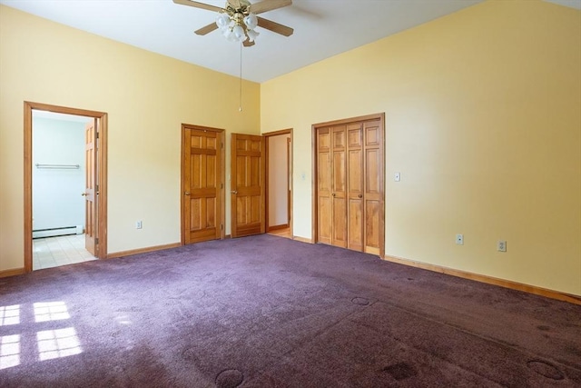 18 Oakwind Holw, Leominster, MA 01453 - unfurnished bedroom featuring a baseboard radiator, carpet, baseboards, two closets, and a towering ceiling