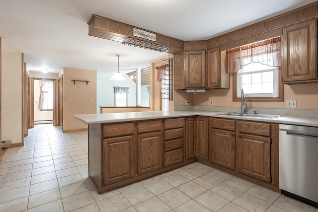 18 Oakwind Holw, Leominster, MA 01453 - kitchen featuring stainless steel dishwasher, a sink, baseboard heating, and light countertops