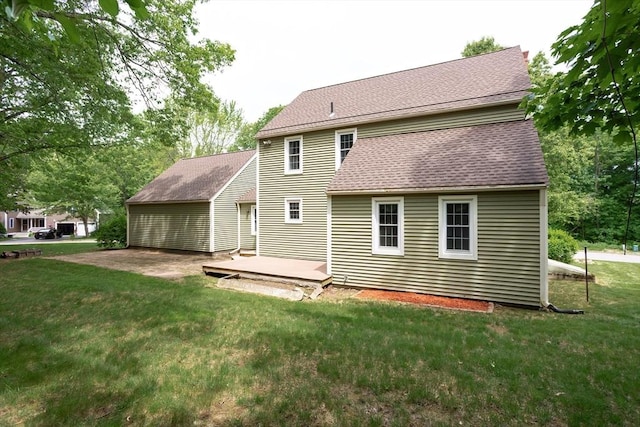18 Oakwind Holw, Leominster, MA 01453 - back of property with a lawn, a shingled roof, and a wooden deck