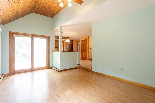 18 Oakwind Holw, Leominster, MA 01453 - unfurnished living room featuring a baseboard radiator, a ceiling fan, vaulted ceiling, light wood finished floors, and baseboards