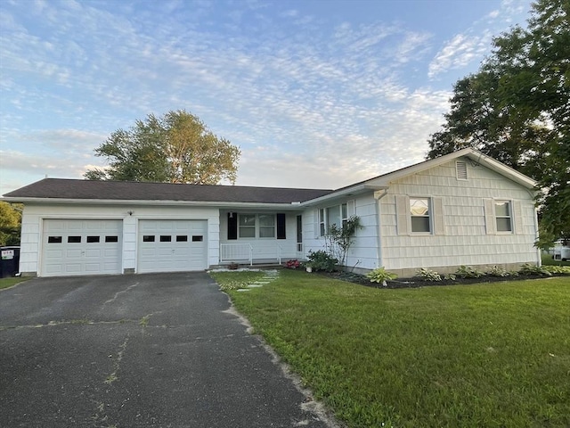 121 Depot Rd, Hatfield, MA 01066 - ranch-style home with asphalt driveway, an attached garage, and a front yard