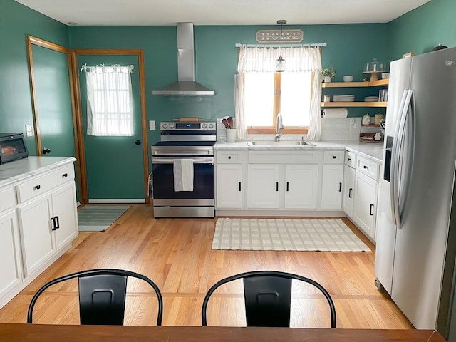 121 Depot Rd, Hatfield, MA 01066 - kitchen featuring appliances with stainless steel finishes, wall chimney range hood, open shelves, white cabinetry, and light countertops