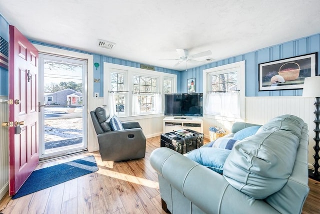 living room featuring ceiling fan and light wood-type flooring