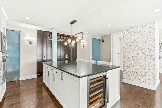65 E India Row Unit 28Ef, Boston, MA 02110 - kitchen featuring beverage cooler, dark countertops, dark wood-type flooring, white cabinets, and recessed lighting
