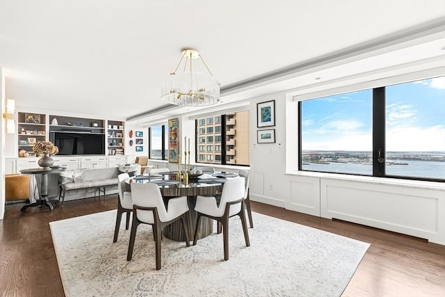 65 E India Row Unit 28Ef, Boston, MA 02110 - dining space featuring a chandelier and wood finished floors