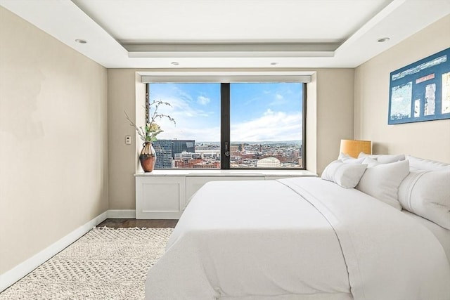 65 E India Row Unit 28Ef, Boston, MA 02110 - bedroom featuring multiple windows and a tray ceiling
