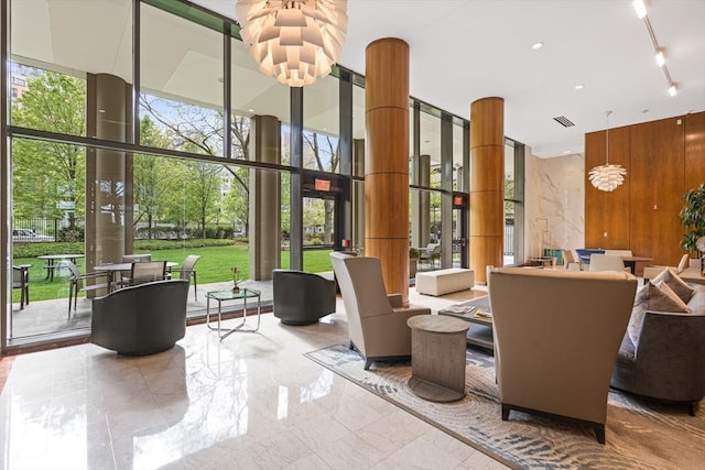 65 E India Row Unit 28Ef, Boston, MA 02110 - building lobby with a wall of windows and a high ceiling