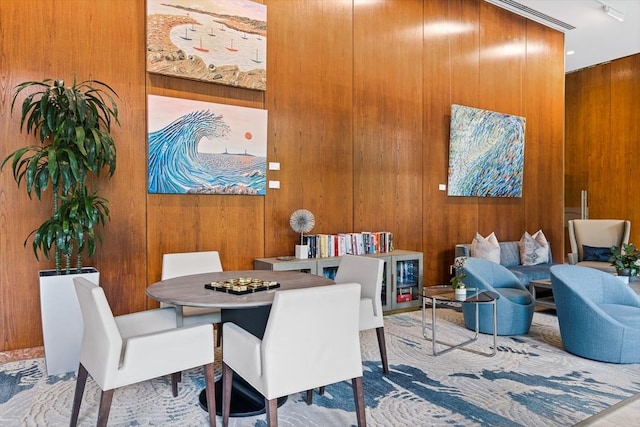 65 E India Row Unit 28Ef, Boston, MA 02110 - dining room featuring wood walls