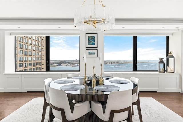 65 E India Row Unit 28Ef, Boston, MA 02110 - dining space featuring healthy amount of natural light, dark wood-style floors, and a decorative wall