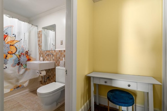 34 Sheafe St Unit 1, Brookline, MA 02467 - bathroom featuring toilet, ornamental molding, tile patterned floors, and a sink