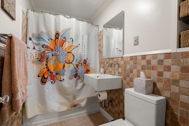 34 Sheafe St Unit 1, Brookline, MA 02467 - full bath with ornamental molding, tile walls, a sink, toilet, and tile patterned floors