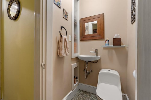 34 Sheafe St Unit 1, Brookline, MA 02467 - bathroom with toilet, tile patterned flooring, baseboards, and a sink